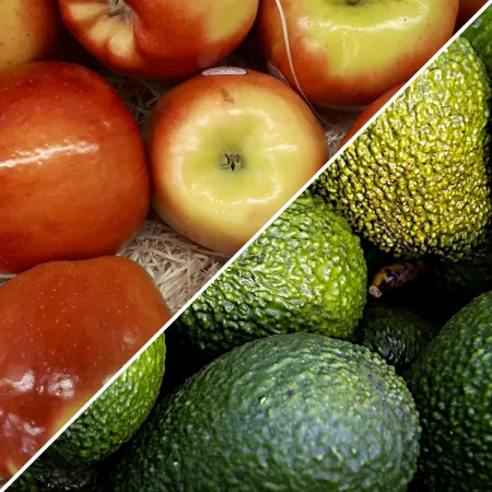 A photo of fresh apples and avocados split diagonally.