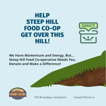 A grass covered hill with a donation box and a message that read, help Steep Hill Food Co-op get over this Hill!