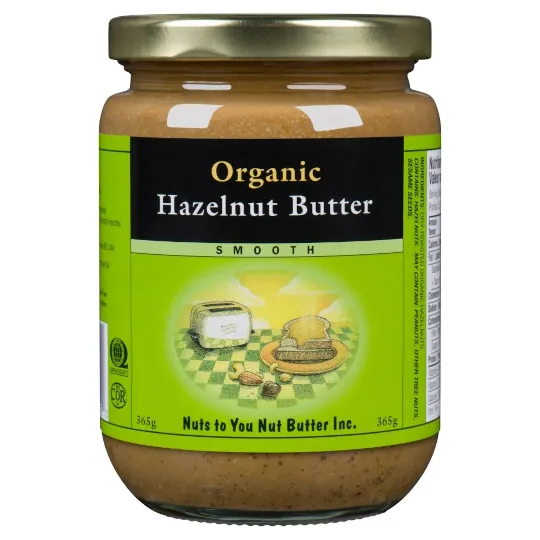 A jar of organic hazelnut butter smooth with a green/black label.
