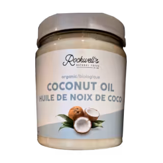 Rockwell's coconut oil in clear jar with a white lid.