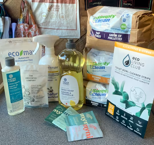 A variety of cleaning products displayed on a counter.
